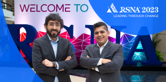 Rishi & Harsh Nayyar standing in front of the 2023 RSNA sign