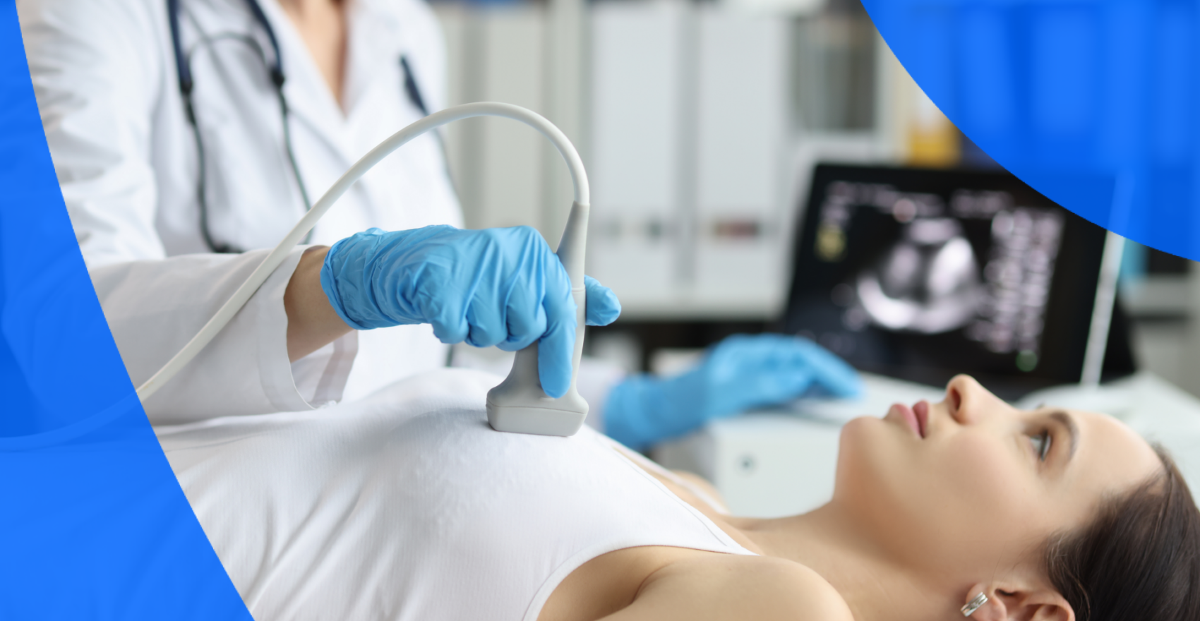 A technician performing a heart ultrasound on a woman